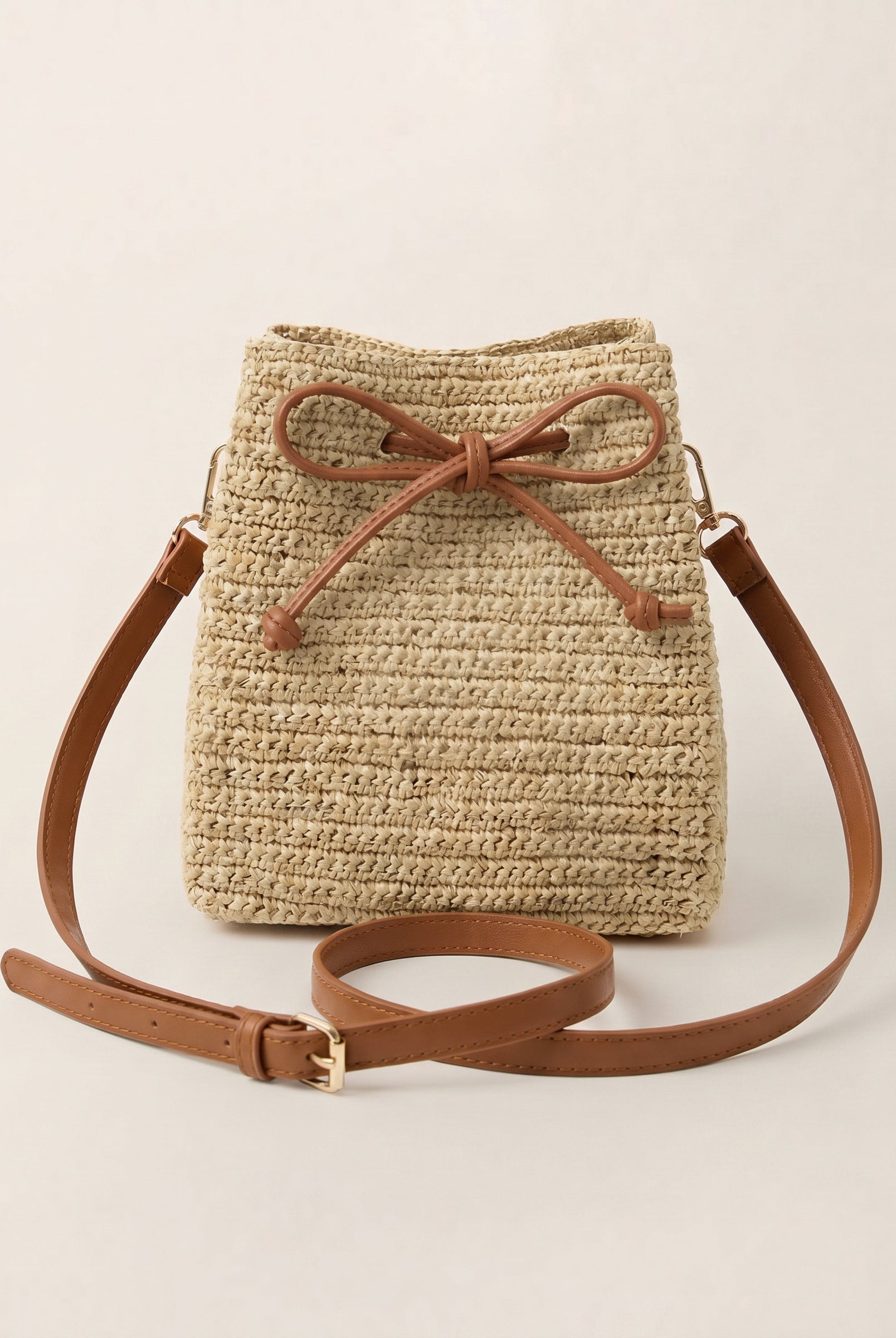 Mini Handwoven Raffia Drawstring Crossbody Bag by LINTICO for women