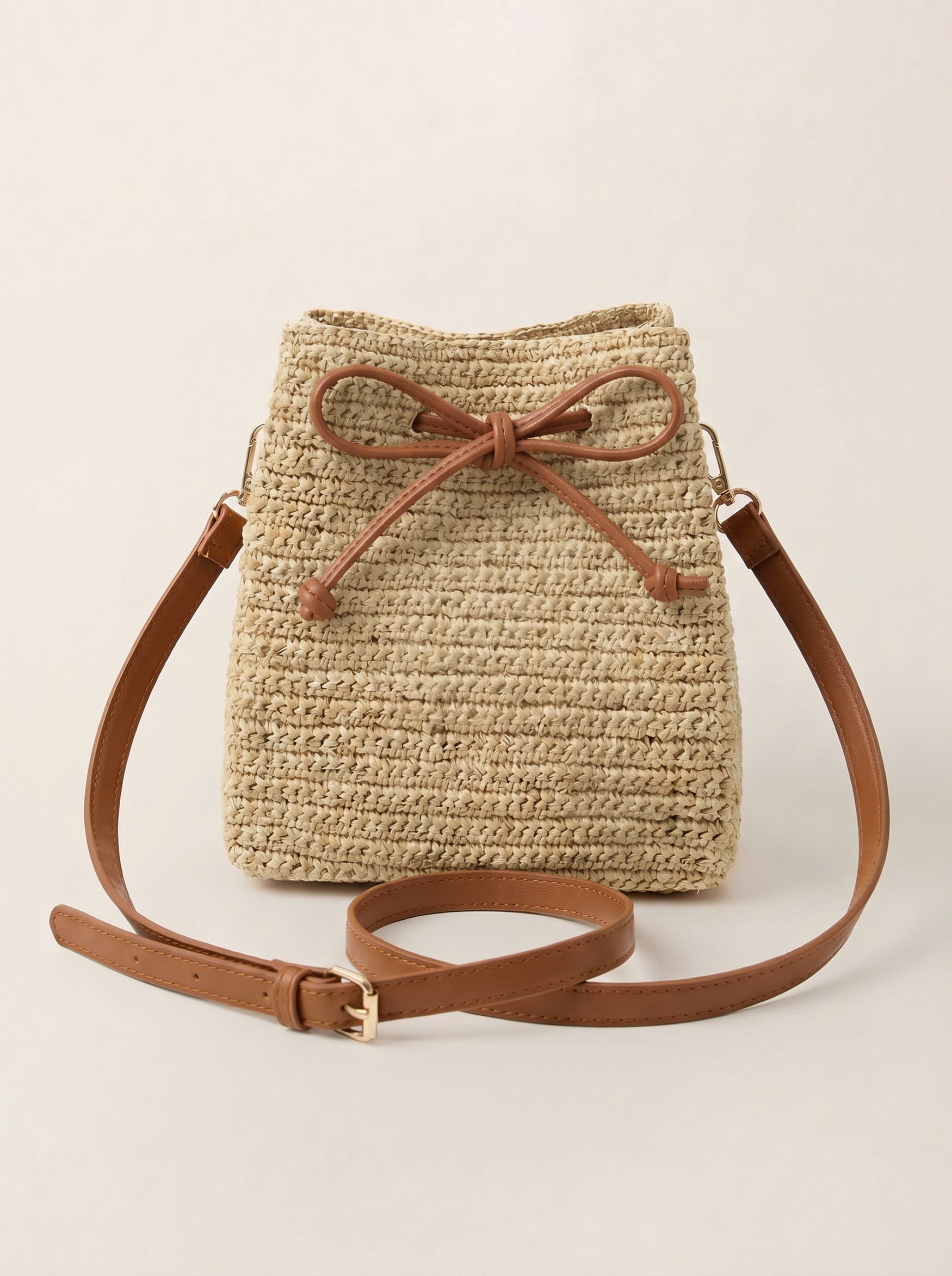 Mini Handwoven Raffia Drawstring Crossbody Bag by LINTICO for women