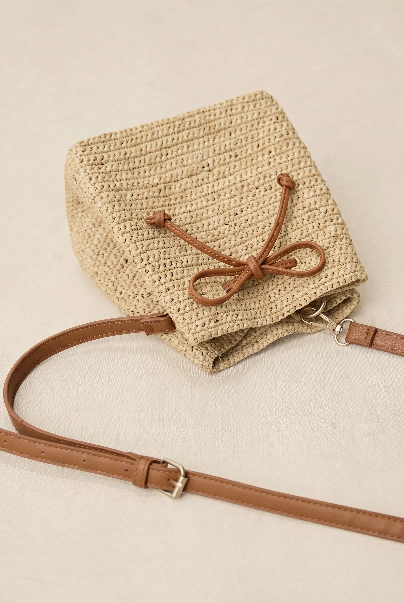 Mini Handwoven Raffia Drawstring Crossbody Bag by LINTICO for women