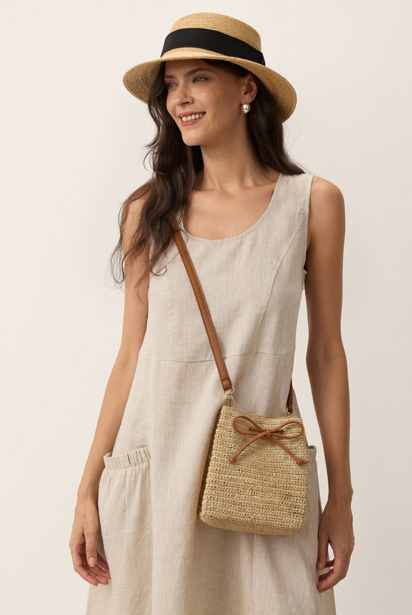 Mini Handwoven Raffia Drawstring Crossbody Bag by LINTICO for women
