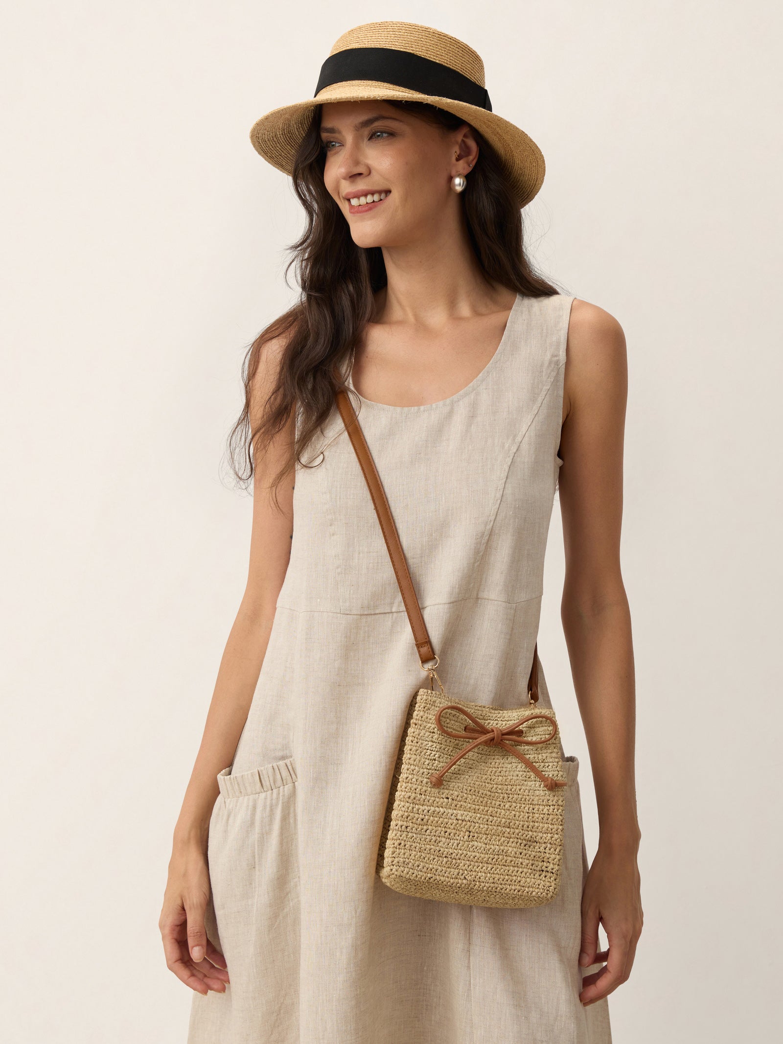 Mini Handwoven Raffia Drawstring Crossbody Bag by LINTICO for women