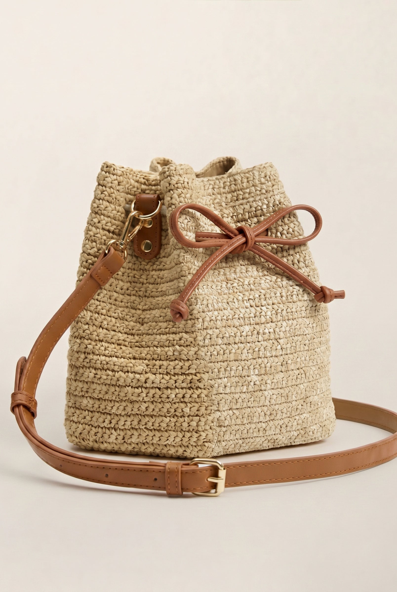 Mini Handwoven Raffia Drawstring Crossbody Bag by LINTICO for women