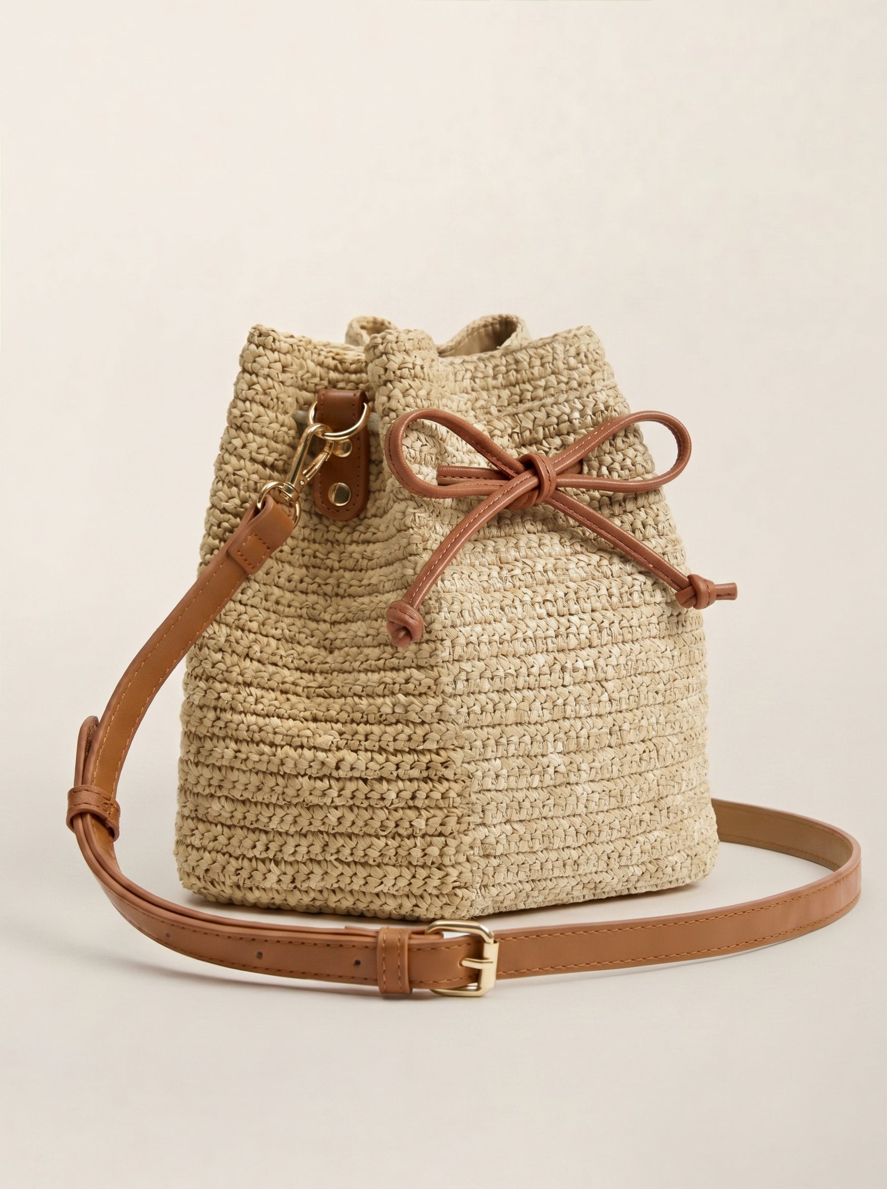 Mini Handwoven Raffia Drawstring Crossbody Bag by LINTICO for women