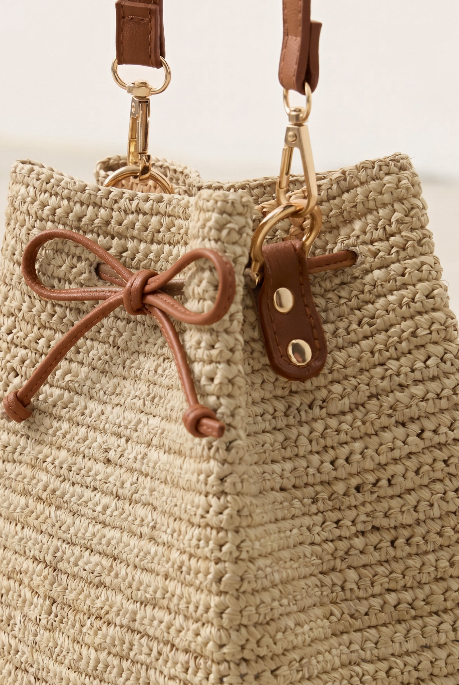 Mini Handwoven Raffia Drawstring Crossbody Bag by LINTICO for women