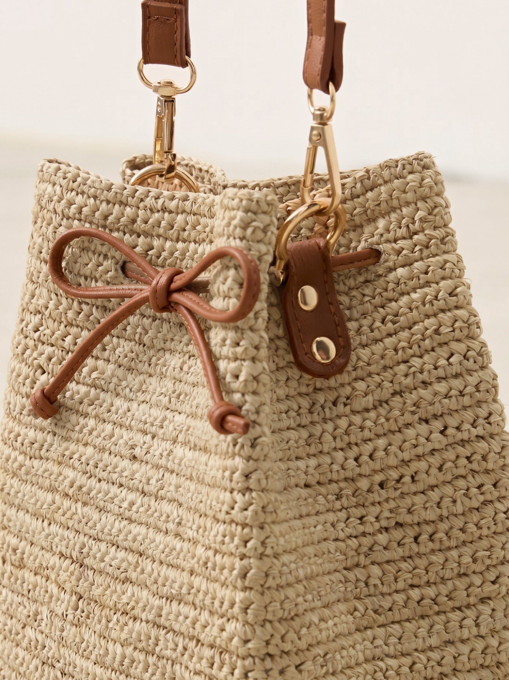 Mini Handwoven Raffia Drawstring Crossbody Bag by LINTICO for women