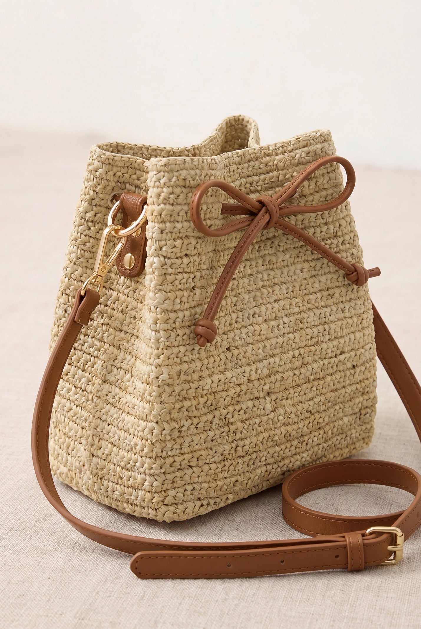 Mini Handwoven Raffia Drawstring Crossbody Bag by LINTICO for women