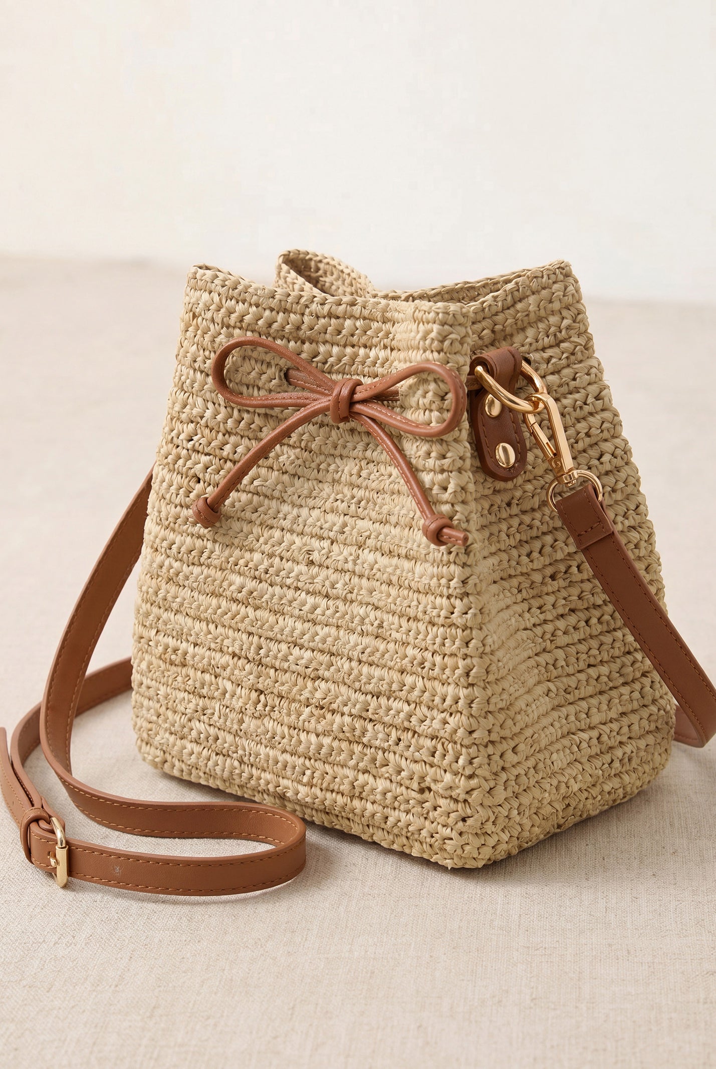 Mini Handwoven Raffia Drawstring Crossbody Bag by LINTICO for women