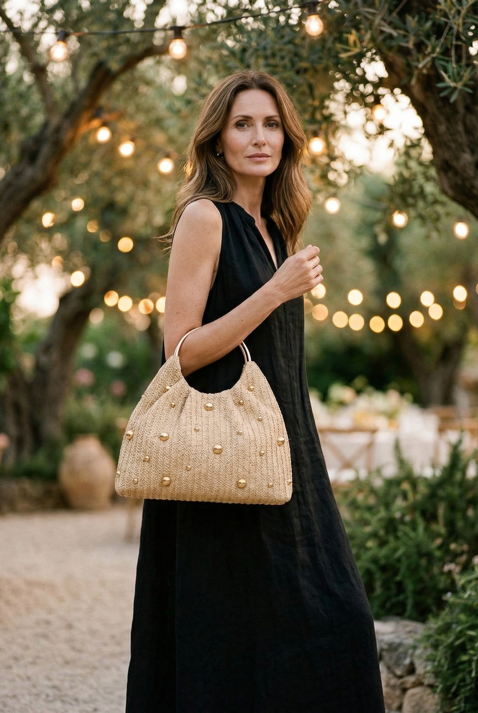 Artisanal Studded Handwoven Raffia Bag with Sculptural Gold Ring Handle by LINTICO for women