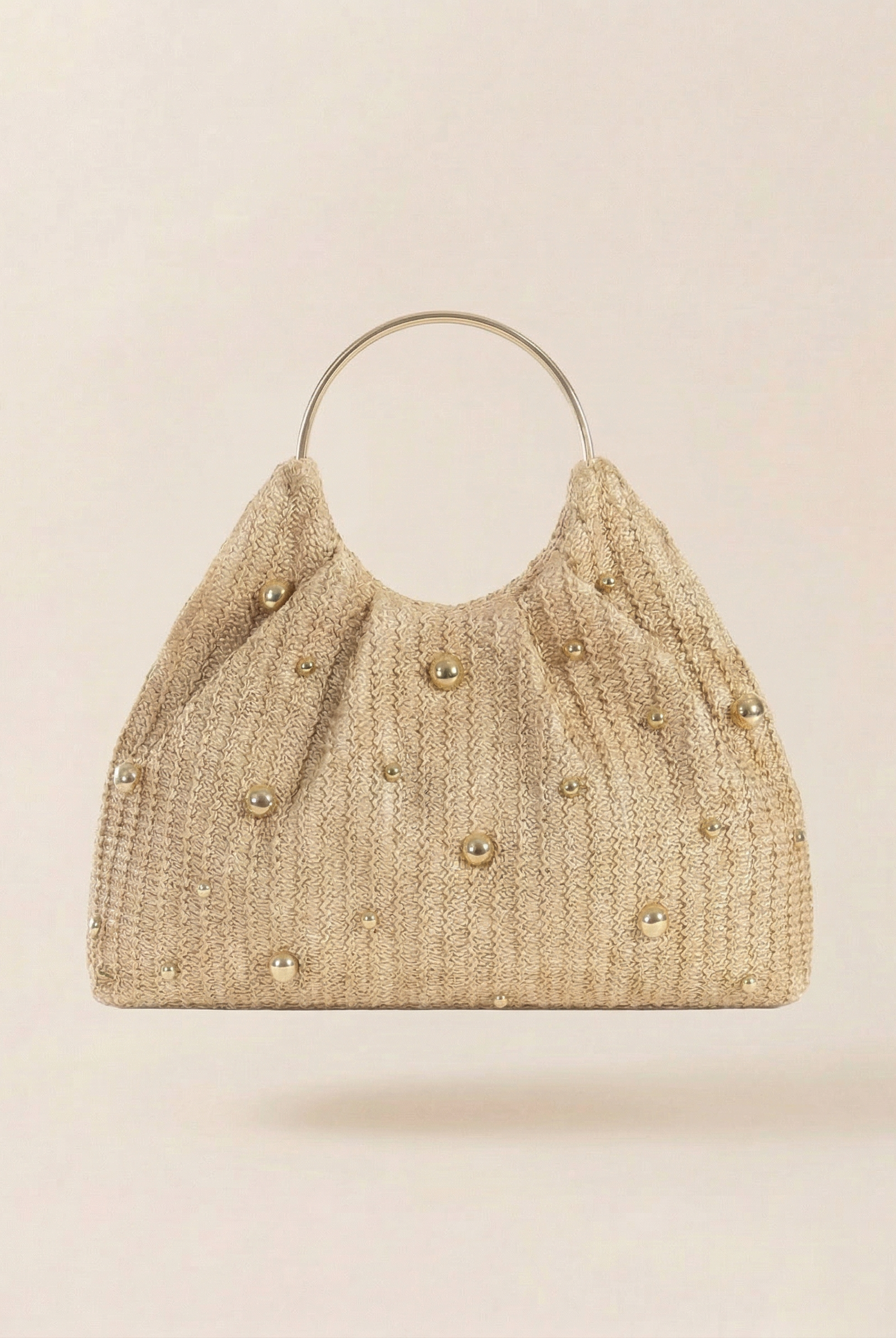 Artisanal Studded Handwoven Raffia Bag with Sculptural Gold Ring Handle by LINTICO for women