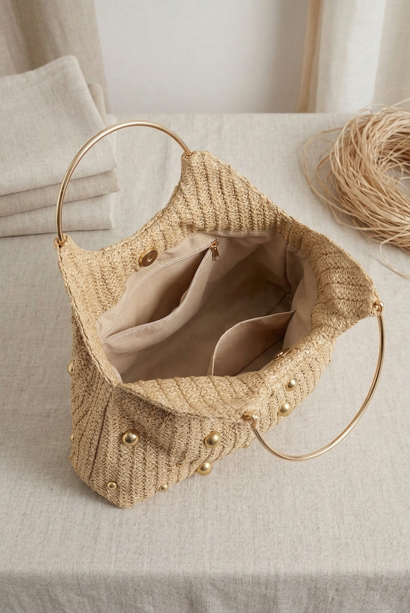 Artisanal Studded Handwoven Raffia Bag with Sculptural Gold Ring Handle by LINTICO for women