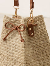 Mini Handwoven Raffia Drawstring Crossbody Bag by LINTICO for women