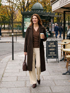 Model wearing Wool Asymmetric Side Ruched Stretch Top BRIONY in Sweet Hazelnut
