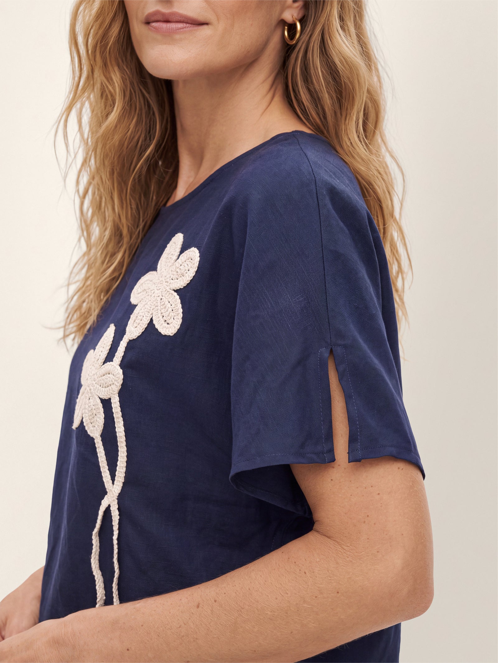 Linen-Lyocell Floral Cord Embroidered Asymmetric Hem Top FLORENE by LINTICO