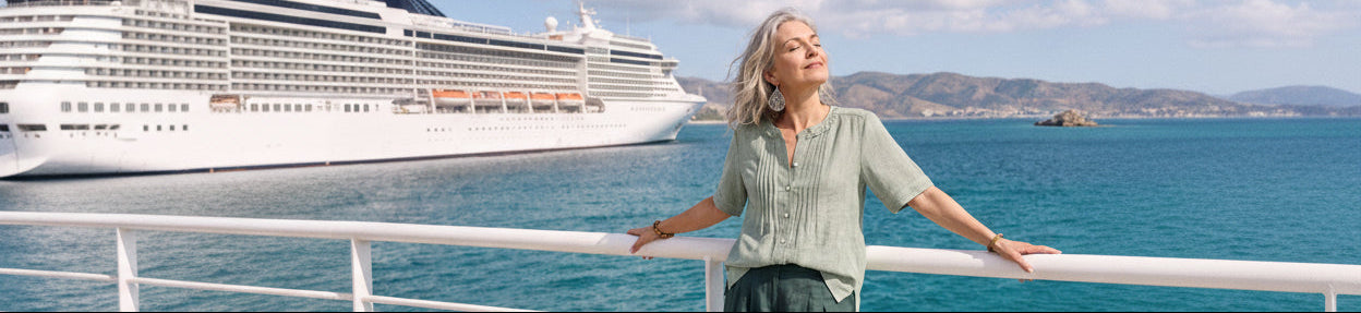 Woman wearing a checked long-sleeved linen blend top with white trousers