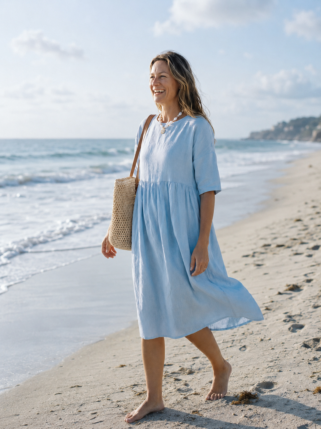 Blue linen beach dress by the sea